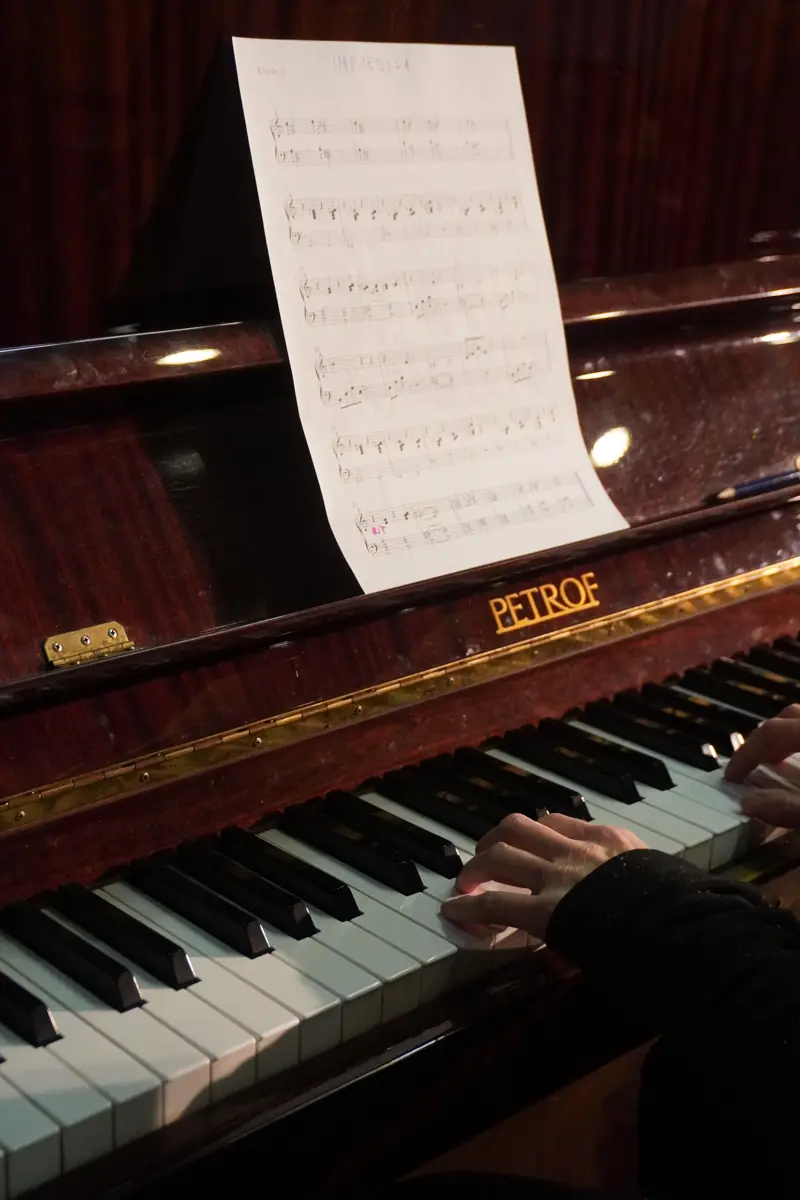 A piano with a score ready for practice